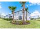 Beautiful exterior of the home featuring a well-manicured lawn and lush landscaping at 844 Driving Range Ct, Reunion, FL 34747