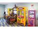 Bright and colorful arcade room featuring various game machines for entertainment at 9033 Hazard St, Davenport, FL 33896