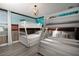 Themed bedroom featuring built-in bunk beds and fun wall art, creating a playful and imaginative space at 9033 Hazard St, Davenport, FL 33896