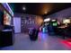 Entertainment room features an arcade, tv and fun decorations at 9033 Hazard St, Davenport, FL 33896