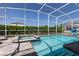 This screened in private pool with jacuzzi offers privacy and is perfect for enjoying the outdoors at 9033 Hazard St, Davenport, FL 33896