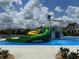 Fun splash pad with slides and play features for in a Gathering-friendly community at 9033 Hazard St, Davenport, FL 33896