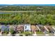 Aerial view of a suburban neighborhood featuring lush greenery, waterways, and well-kept residences at 908 Jade Forest Ave, Orlando, FL 32828