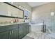 Modern bathroom featuring double vanity, freestanding tub, and walk-in shower with marble accents at 908 Jade Forest Ave, Orlando, FL 32828