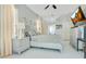 Bright bedroom with white floors, modern furniture, and a ceiling fan at 908 Jade Forest Ave, Orlando, FL 32828