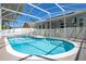 Sparkling screened pool with clear blue water and a pristine, -proof surrounding enclosure at 908 Jade Forest Ave, Orlando, FL 32828