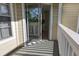 A serene outdoor balcony with sliding glass doors and a white railing at 1017 S Hiawassee Rd # 3735, Orlando, FL 32835