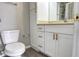 Bright bathroom featuring a white vanity with gold pulls at 1017 S Hiawassee Rd # 3735, Orlando, FL 32835
