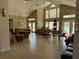 Spacious clubhouse showcasing high ceilings, tile floors, ample seating, and a view of the pool at 1017 S Hiawassee Rd # 3735, Orlando, FL 32835