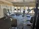 Bright gym area complete with treadmills, elliptical machines, and weight-lifting equipment at 1017 S Hiawassee Rd # 3735, Orlando, FL 32835