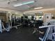 Spacious gym featuring mirrored walls, exercise equipment, and ample natural light at 1017 S Hiawassee Rd # 3735, Orlando, FL 32835
