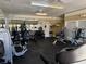 Fully-equipped gym with a variety of modern exercise machines and a mirrored wall at 1017 S Hiawassee Rd # 3735, Orlando, FL 32835
