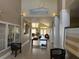 Bright condo lobby entrance featuring tile flooring, neutral walls, and Tradewinds signage overhead at 1017 S Hiawassee Rd # 3735, Orlando, FL 32835