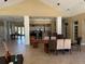 Clubhouse lounge area offers neutral colors, tile flooring, and access to community amenities at 1017 S Hiawassee Rd # 3735, Orlando, FL 32835