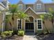 Building exterior featuring mailboxes, lush landscaping, and a well-maintained façade at 1017 S Hiawassee Rd # 3735, Orlando, FL 32835