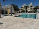 Community pool, and views of the nearby buildings with balconies at 1017 S Hiawassee Rd # 3735, Orlando, FL 32835
