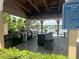 Outdoor summer kitchen featuring grills, countertop space, and a view of a scenic lake at 1017 S Hiawassee Rd # 3735, Orlando, FL 32835