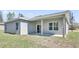 The home features a covered back patio with sliding door access to the interior living space at 12781 Sw 86Th Circle, Ocala, FL 34473