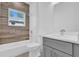 Bathroom features a combination tub and shower at 12781 Sw 86Th Circle, Ocala, FL 34473