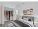 Bedroom with neutral colors, an open closet and contemporary decor at 12781 Sw 86Th Circle, Ocala, FL 34473