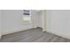 Bedroom features window with blinds and closet with open bi-fold doors at 12781 Sw 86Th Circle, Ocala, FL 34473