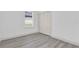 Bedroom features window with blinds and closet with closed bi-fold doors at 12781 Sw 86Th Circle, Ocala, FL 34473