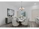 Elegant dining room with modern light fixture, marble table, and neutral accents at 12781 Sw 86Th Circle, Ocala, FL 34473