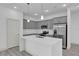 Bright kitchen featuring gray cabinetry, stainless steel appliances and center island at 12781 Sw 86Th Circle, Ocala, FL 34473