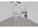 Bright living space with hardwood floors, gray cabinets, stainless steel appliances and open floor plan at 12781 Sw 86Th Circle, Ocala, FL 34473