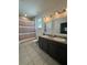 Bathroom featuring a double vanity with gray cabinets and tile flooring at 1337 Ash Tree Cv, Casselberry, FL 32707