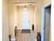 Inviting foyer features neutral walls, decorative accents and flooring with decorative area rug at 1337 Ash Tree Cv, Casselberry, FL 32707