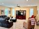 Spacious living room featuring tile flooring, neutral walls, comfortable seating, and natural light at 1337 Ash Tree Cv, Casselberry, FL 32707