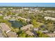 Drone shot of condo community with central lake, fountain, pool, and easy access to nearby shopping and dining at 15 Escondido Ct # 145, Altamonte Springs, FL 32701