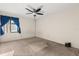 A standard bedroom, with tan carpet, an electrical outlet and a single window at 15 Escondido Ct # 145, Altamonte Springs, FL 32701