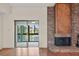 A corner view highlights a unique fireplace and view of the waterway through sliding glass doors at 15 Escondido Ct # 145, Altamonte Springs, FL 32701