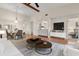 Interior view of staged living room and dining area with ceiling fan and hardwood floors at 15 Escondido Ct # 145, Altamonte Springs, FL 32701