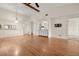 Spacious open-concept living room with laminate floors and a built-in bar area at 15 Escondido Ct # 145, Altamonte Springs, FL 32701