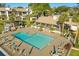 Aerial view of community pool with ample seating and shade, perfect for hot summer days at 15 Escondido Ct # 145, Altamonte Springs, FL 32701