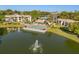 Aerial view of community pool overlooking the lake, perfect for relaxation and social gatherings at 15 Escondido Ct # 145, Altamonte Springs, FL 32701