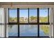 Large windows offering a serene water view and ample natural light at 15 Escondido Ct # 145, Altamonte Springs, FL 32701