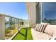 Inviting balcony with seating and artificial turf, overlooking a scenic cityscape and lake at 150 E Robinson St # 807, Orlando, FL 32801