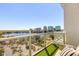 Cozy balcony with artificial grass and seating, offering panoramic views of the lake and city skyline at 150 E Robinson St # 807, Orlando, FL 32801