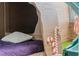 Cozy bedroom featuring a custom play area with a bed and fun, themed decorations at 1565 Mulligan Blvd, Davenport, FL 33896