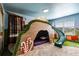 Whimsical bedroom with unique custom bed and slide feature at 1565 Mulligan Blvd, Davenport, FL 33896