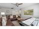 Entertainment living room with stylish furniture, a ceiling fan, and a full air hockey table, perfect for fun at 1565 Mulligan Blvd, Davenport, FL 33896