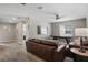 Comfortable living room with stylish furniture and an air hockey table, perfect for relaxing and entertaining at 1565 Mulligan Blvd, Davenport, FL 33896