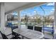 Outdoor patio with a dining table and chairs, perfect for enjoying meals with a pool view at 1565 Mulligan Blvd, Davenport, FL 33896