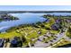Aerial view of the community with winding roads, a pond, lake, green space, and beautiful homes at 16003 Tangerine Blossom Way, Winter Garden, FL 34787