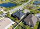 Aerial view of home with backyard showcasing privacy, landscaping, and pond views in the community at 16003 Tangerine Blossom Way, Winter Garden, FL 34787