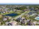 A beautiful aerial view showing community ponds, landscaping, amenities, and the layout of the neighborhood at 16003 Tangerine Blossom Way, Winter Garden, FL 34787